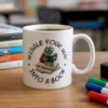 Wiggle Into a Book Vector Art – Cute Reading Caterpillar with Motivational Quote on a mug